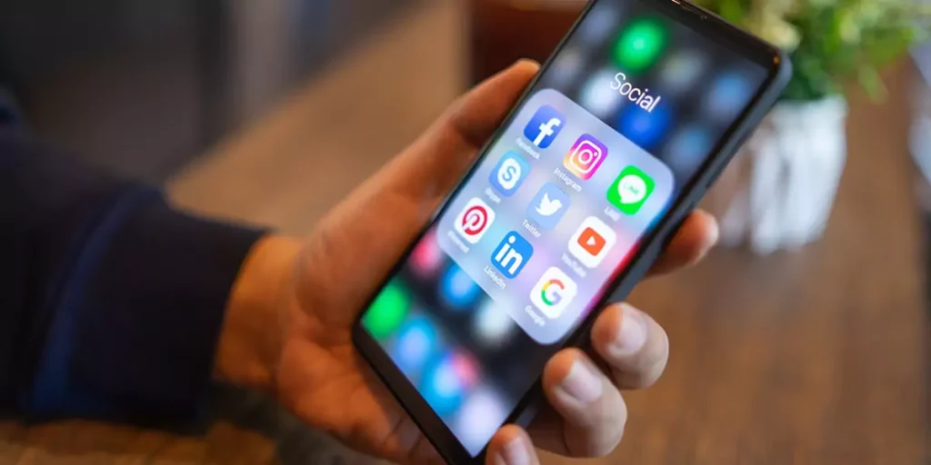 Restaurant customer looking at social media apps